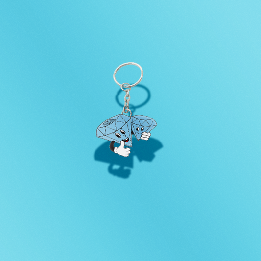 Keychain with cartoon character holding diamonds on a blue background
